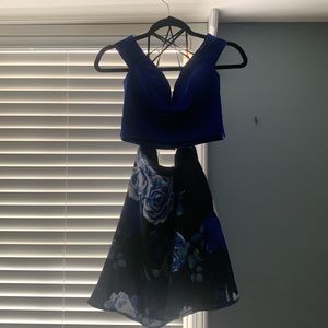 It is a beautiful royal blue 2 piece with flower skirt from Dillards.